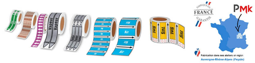 Série de différents rouleaux adhésifs pour le marquage de la tuyauterie PREVENTIMARK avec à gauche le dessin de la France avec le logo PMK et le logo fabriqué en France garantie 
            avec la mention fabrication dans nos ateliers en région Auvergne Rhône-Alpes (Feyzin) inscrite en dessous. 